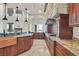 Spacious kitchen with granite countertops, custom cabinetry, and chef-grade appliances at 5790 Aspen Falls Cir, Las Vegas, NV 89149