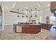 Large island kitchen with granite counters, stainless appliances, and custom cabinets at 5790 Aspen Falls Cir, Las Vegas, NV 89149