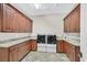 Well-equipped laundry room with ample cabinet space, granite counters, and modern washer/dryer units at 5790 Aspen Falls Cir, Las Vegas, NV 89149