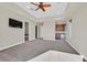 Expansive main bedroom with a ceiling fan, a beverage center, and an attached bathroom at 5790 Aspen Falls Cir, Las Vegas, NV 89149
