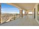 Beautiful stone patio with a wrought iron railing and views of the mountains and city at 5790 Aspen Falls Cir, Las Vegas, NV 89149