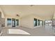 Large patio features sliding doors that lead into the home with mountain views at 5790 Aspen Falls Cir, Las Vegas, NV 89149