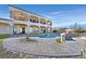 Backyard pool with rock waterfall features and lush desert landscaping at 5790 Aspen Falls Cir, Las Vegas, NV 89149