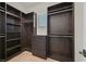 Spacious walk-in closet with custom built-in shelving and drawers, maximizing storage and organization at 5790 Aspen Falls Cir, Las Vegas, NV 89149