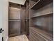 Custom walk-in closet with shelving and drawers, providing ample storage and organization at 5790 Aspen Falls Cir, Las Vegas, NV 89149