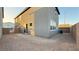 Large backyard featuring a concrete block wall and ample space for outdoor activities and landscaping at 7308 Davenbury St, Las Vegas, NV 89113