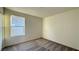 Bedroom featuring neutral carpet, white walls, and natural light at 7308 Davenbury St, Las Vegas, NV 89113