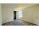 Bedroom features neutral carpet, white walls, and a walk-in closet at 7308 Davenbury St, Las Vegas, NV 89113