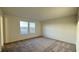 Spacious bedroom with plush carpeting and large windows offering ample natural light and a view at 7308 Davenbury St, Las Vegas, NV 89113
