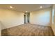 Bonus room featuring neutral carpet, white walls, recessed lighting, and two entry doors at 7308 Davenbury St, Las Vegas, NV 89113