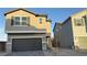 Charming two-story home showcasing a gray facade, well-manicured landscaping, and a two-car garage at 7308 Davenbury St, Las Vegas, NV 89113