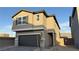 Charming two-story home with a grey finish, stone accents, and a two-car garage at 7308 Davenbury St, Las Vegas, NV 89113