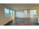 Open living space with modern flooring, backyard access and many windows for optimal natural light at 7308 Davenbury St, Las Vegas, NV 89113
