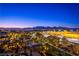 Night aerial view of the community with city lights and mountains in background at 9101 Alta Dr # 505, Las Vegas, NV 89145