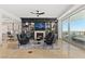 Living room with fireplace, built-ins, and city views at 9101 Alta Dr # 505, Las Vegas, NV 89145
