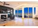 Living room with fireplace, seating area, and access to a balcony with city views at 9101 Alta Dr # 505, Las Vegas, NV 89145