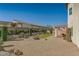 Artificial turf and desert landscaping in backyard at 9893 Cove Haven Ct, Las Vegas, NV 89178