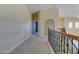 Upper hallway with carpet and railing at 9893 Cove Haven Ct, Las Vegas, NV 89178