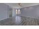 Large bedroom with gray floors and ceiling fan at 10701 Penfolds St, Las Vegas, NV 89183