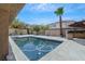 Relaxing pool area with ample patio space for lounging and entertaining at 10701 Penfolds St, Las Vegas, NV 89183