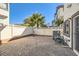 Private backyard with brick patio and small palm tree at 1336 Allegheny Moon Ter # 103, Henderson, NV 89002