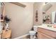 Small bathroom with single sink vanity and decorative wall art at 1336 Allegheny Moon Ter # 103, Henderson, NV 89002