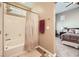 Bathroom with tub, shower, and view into bedroom at 1336 Allegheny Moon Ter # 103, Henderson, NV 89002