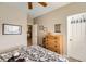Bedroom with dresser, window, and view into adjacent room at 1336 Allegheny Moon Ter # 103, Henderson, NV 89002