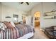 Main bedroom with ensuite bathroom access and cozy sitting area at 1336 Allegheny Moon Ter # 103, Henderson, NV 89002