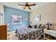 Bedroom with double bed, dresser, and blue accent wall at 1336 Allegheny Moon Ter # 103, Henderson, NV 89002