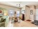 Small dining area with round table and chairs near the living room at 1336 Allegheny Moon Ter # 103, Henderson, NV 89002