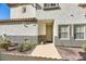 Front entrance of the house with walkway and landscaping at 1336 Allegheny Moon Ter # 103, Henderson, NV 89002