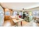 Open kitchen features island, wood cabinets, and breakfast bar at 1336 Allegheny Moon Ter # 103, Henderson, NV 89002