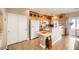 Bright kitchen boasts wood cabinets, island, and stainless steel appliances at 1336 Allegheny Moon Ter # 103, Henderson, NV 89002