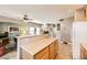 Kitchen with breakfast bar and view into living room at 1336 Allegheny Moon Ter # 103, Henderson, NV 89002