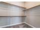 Walk-in closet with ample shelving and hanging rods at 1536 Unison Way # 102, Las Vegas, NV 89135