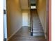 Bright entryway with wood-look tile flooring and staircase at 1536 Unison Way # 102, Las Vegas, NV 89135