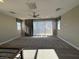 Spacious loft area with carpet flooring and large windows at 1536 Unison Way # 102, Las Vegas, NV 89135