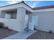 Condo exterior view, showing the building entrance and landscaping at 1726 N Jones Blvd, Las Vegas, NV 89108