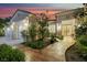 Inviting front entrance with mature landscaping and stone pathway leading to the glass-paneled front door at 1805 Prichard Ave, Henderson, NV 89052