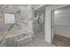 Luxurious bathroom with soaking tub, walk-in shower, and marble accents at 1964 Westwind Rd, Las Vegas, NV 89146