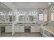 Bathroom boasts double vanity, soaking tub, and marble tile at 1964 Westwind Rd, Las Vegas, NV 89146