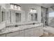 Double vanity bathroom with granite countertops and LED mirrors at 1964 Westwind Rd, Las Vegas, NV 89146