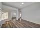 Spacious bedroom featuring wood-look floors and mirrored closet doors at 1964 Westwind Rd, Las Vegas, NV 89146