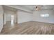 Large bedroom with wood-look floors and access to other rooms at 1964 Westwind Rd, Las Vegas, NV 89146