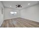 Spacious bedroom with wood-look floors and ceiling fan at 1964 Westwind Rd, Las Vegas, NV 89146