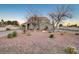 House exterior with a spacious yard and mature trees at 1964 Westwind Rd, Las Vegas, NV 89146