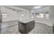 Modern kitchen with breakfast bar and stainless steel appliances at 1964 Westwind Rd, Las Vegas, NV 89146