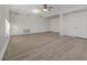 Open living room with vinyl plank flooring and a ceiling fan at 1964 Westwind Rd, Las Vegas, NV 89146