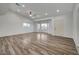 Spacious living room featuring wood-look floors and abundant natural light at 1964 Westwind Rd, Las Vegas, NV 89146